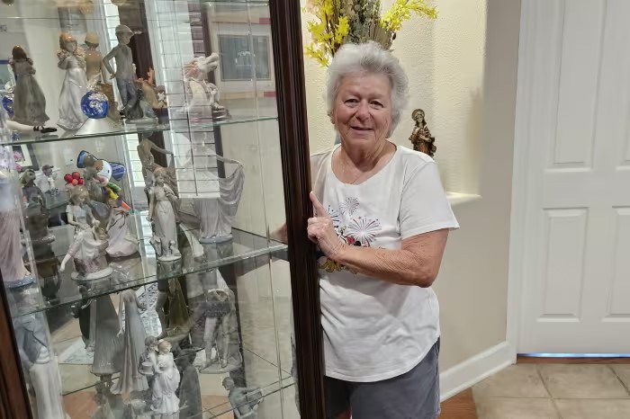 Dottie Robinson with her late father’s Lladró collection, which her stepmother gave her before she died. 