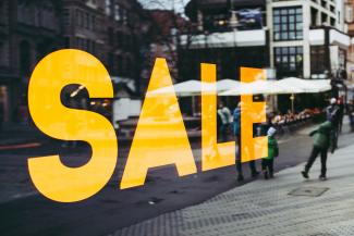 man in green jacket walking on sidewalk during daytime by Markus Spiske courtesy of Unsplash.