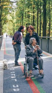 woman sitting on wheelchair by Raychan courtesy of Unsplash.