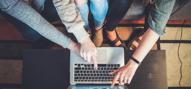 three person pointing the silver laptop computer by John Schnobrich courtesy of Unsplash.