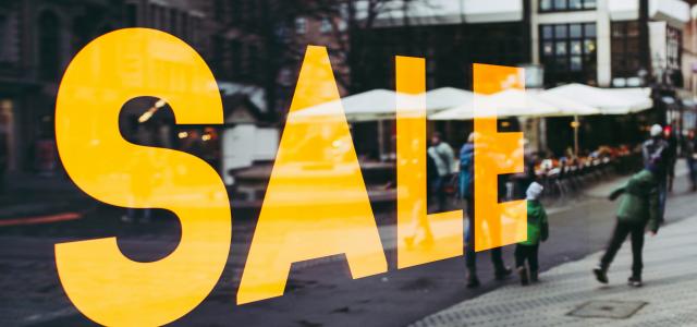 man in green jacket walking on sidewalk during daytime by Markus Spiske courtesy of Unsplash.