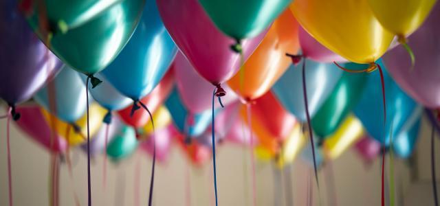 selective focus photography of assorted-color balloons by Adi Goldstein courtesy of Unsplash.